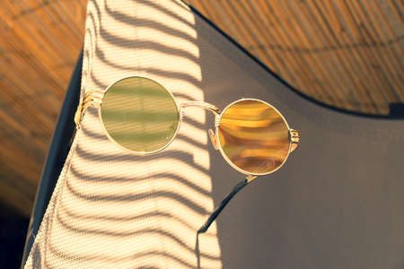 Vintage steampunk sunglasses model with round lense in a sunny day closeup. Selective Focusの写真素材