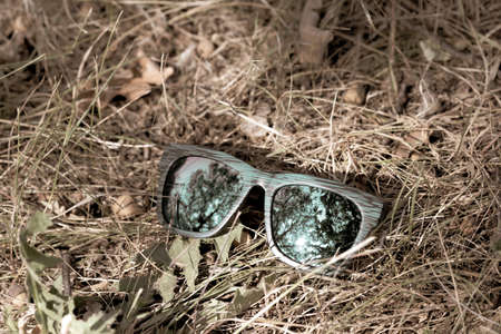 Classic sunglasses model shoot outdoor in a sunny day closeup . Selective focusの写真素材