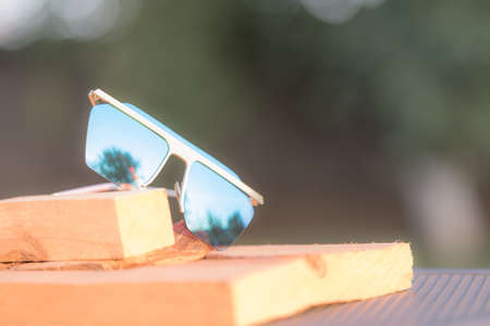 Futuristic oversized sunglasses model with blue lenses shoot outdoor closeup . Selective focusの写真素材