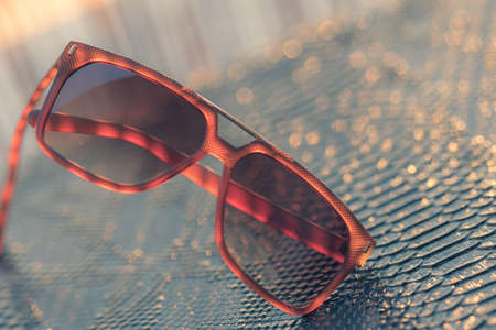 Classic sunglasses model shoot in a summer day closeup. Selective focusの写真素材
