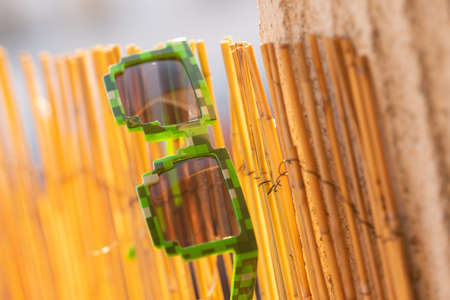 Green thug life pixel model sunglasses shoot outside in a sunny day closeup. Selective focusの写真素材