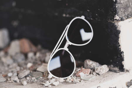 Retro aviator sunglasses model with big black lenses closeup . Selective focusの写真素材