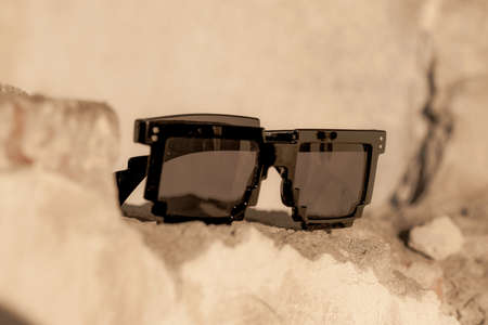 Black pixel sunglasses with black lenses closeup in a sunny day. Selective focusの写真素材