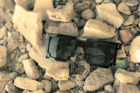 Black pixel sunglasses with black lenses closeup in a sunny day. Selective focusの写真素材