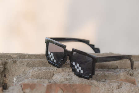 Black pixel sunglasses thug life with black lenses closeup. Selective focusの写真素材