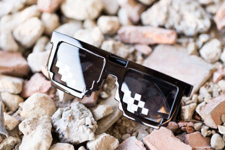 Black pixel sunglasses thug life with black lenses closeup. Selective focusの写真素材