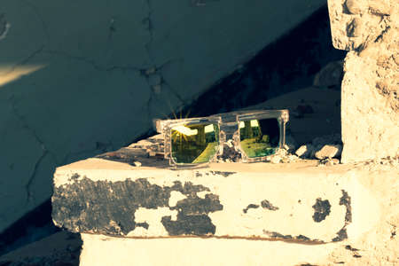 Pixel sunglasses model shoot in a urban place closeup in a sunny day. Selective focusの写真素材