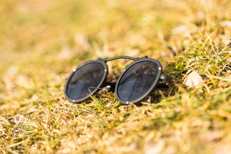 Steampunk sunglasses with big round lens shoot outside in a sunny day closeup. Selective Focusの写真素材