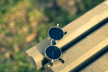 Steampunk sunglasses model with black lenses shoot outside in a summer day closeup. Selective Focusの写真素材