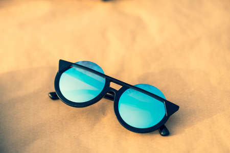 Sunglasses special model with big blue lenses for ladies with special design shoot outdoors closeup. Selective focusの写真素材