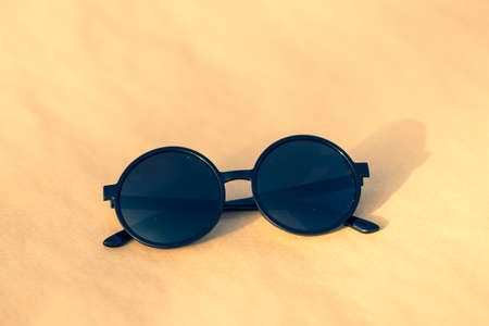 Sunglasses with big black round lens shoot outside in a summer day closeup. Selective Focusの写真素材