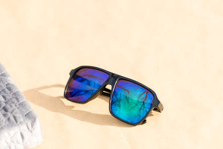Classic Sunglasses model with green lenses shoot outside place in a summer day. Selective focusの写真素材