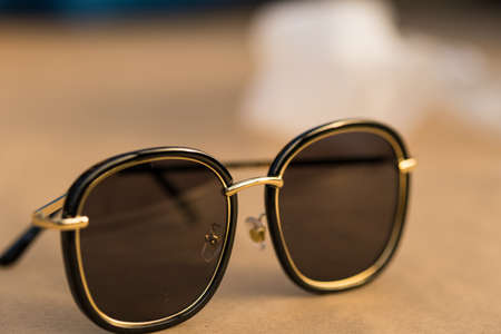 Sunglasses with big black round lenses shoot outdoors in a sunny day closeup. Selective Focusの写真素材