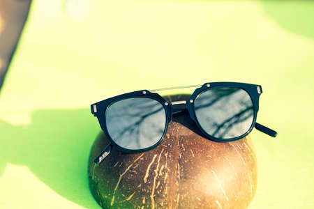 Black sunglasses classic design with silver lenses shoot in a sunny day of summer closeup. Selective Focusの写真素材