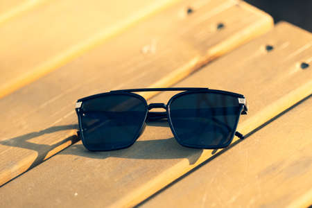Oversized sunglasses model with big black lenses shoot outside in nature in a summer day closeup . Selective focusの写真素材