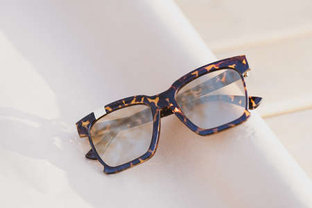 Leopard sunglasses color model for women with big lenses shoot outside in nature in a summer day . Selective focusの写真素材