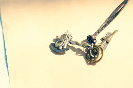 Vintage gothic pendant ax necklace bronze color closeup. Selective Focusの写真素材