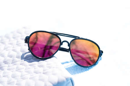 Sunglasses aviator design with big lenses shoot outside in a summer day closeup . Selective focusの写真素材