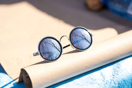 Classic sunglasses classic design with silver lenses shoot in a sunny day of summer closeup....