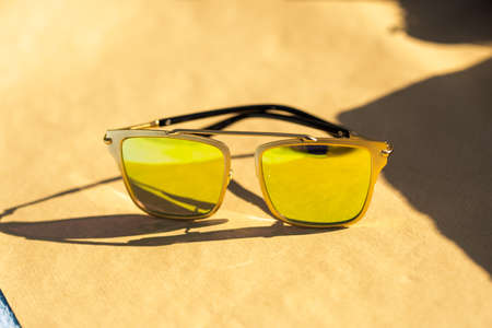 Futuristic sunglasses design with big green lenses closeup shoot outside in a summer day . Selective focusの写真素材