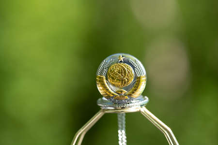 Pocket watch sovietic design shoot outside in a summer day closeup. Selective Focusの写真素材
