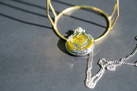 Pocket watch sovietic design shoot outside in a summer day closeup. Selective Focusの写真素材