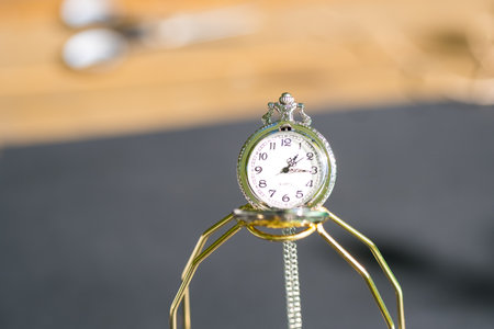 Pocket watch sovietic design shoot outside in a summer day closeup. Selective Focusの写真素材