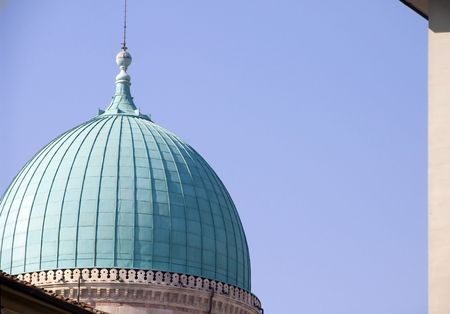 The blue dome of synagogue with tall spire and architectural decorationの写真素材