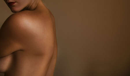 Woman's nude back done in aged effectの写真素材