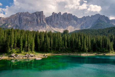 Carezza Lake with Dolomites mountains in the background, Italyの写真素材