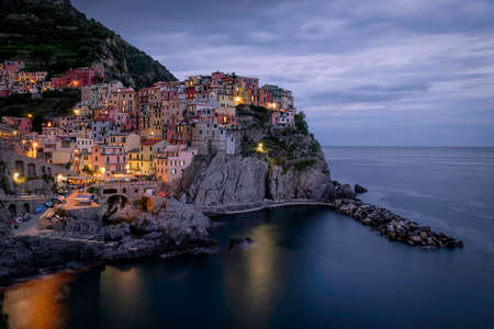 View of Manarola village at sunset, Cinque Terre, Italyの写真素材