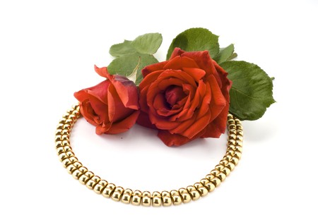  necklace and red rose on white backgroundの写真素材
