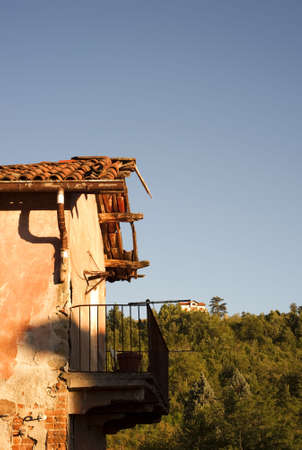 Old balcony struck by the rays of the setting sunの写真素材