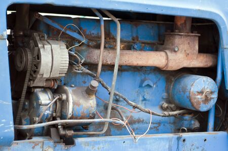 Details of an old engine of a tractorの写真素材