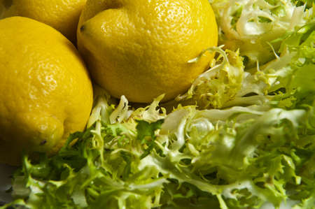 Close up of a plate of salad and lemonの写真素材