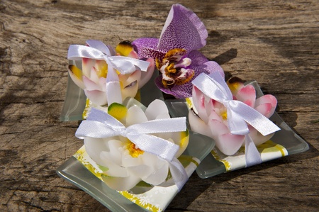weeding Favors and pink orchid on wooden tableの写真素材