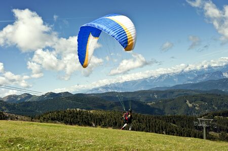 Paraglider flying over the Alps of Trentinoのeditorial素材
