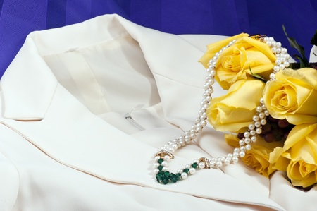 Wedding dress,necklace and yellow roses の写真素材