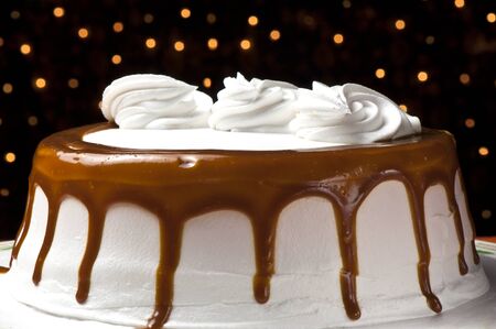 Cream cake with caramel  on colored background