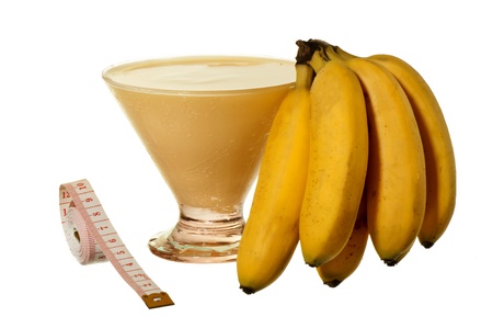 banana smoothie and bananas on white backgroundの写真素材