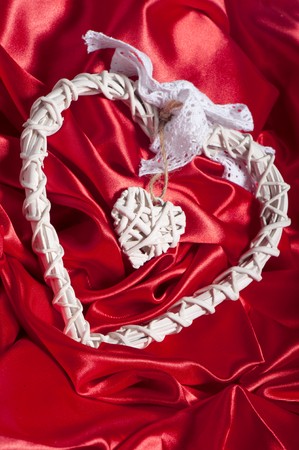 a elegant heart on a red fabricの写真素材