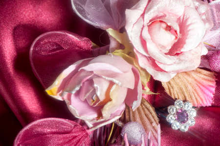  wedding rings on  a colorful fabric background