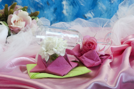 Elegant origami napkins to decorate the table on fabric background