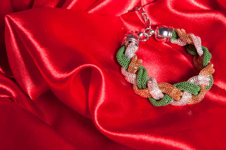 a fantasy Bracelet on a red fabric 