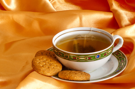  ginger and orange tea and wholemeal biscuitsの写真素材