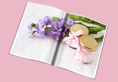 book of a powder jars on a white towelの写真素材