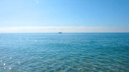 sailboat on a calm summer dayの写真素材