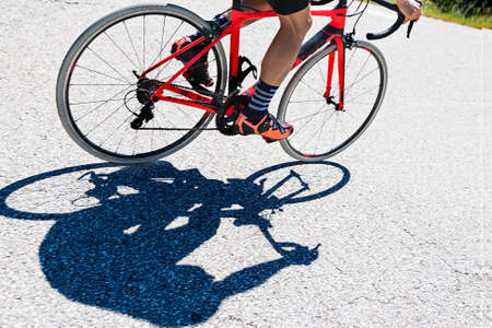 back view of a cyclist on top of a mountains. sport conceptの写真素材