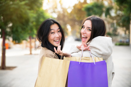 Happy young women shopping in the cityの写真素材