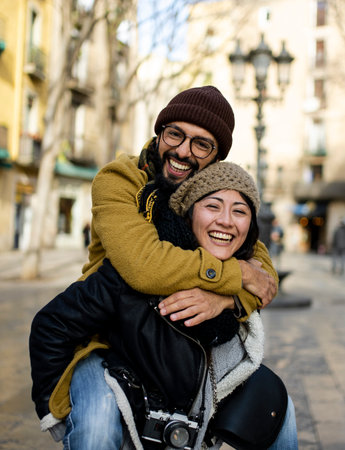 Couple of tourists having fun walking on city street at holiday - Happy friends laughing together on vacation - People and holidays conceptの写真素材